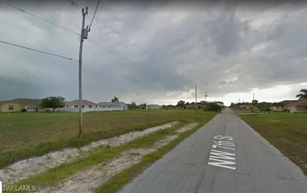 View of asphalt street with a residential view