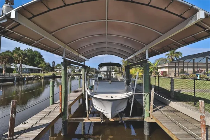 Dock area featuring a water view