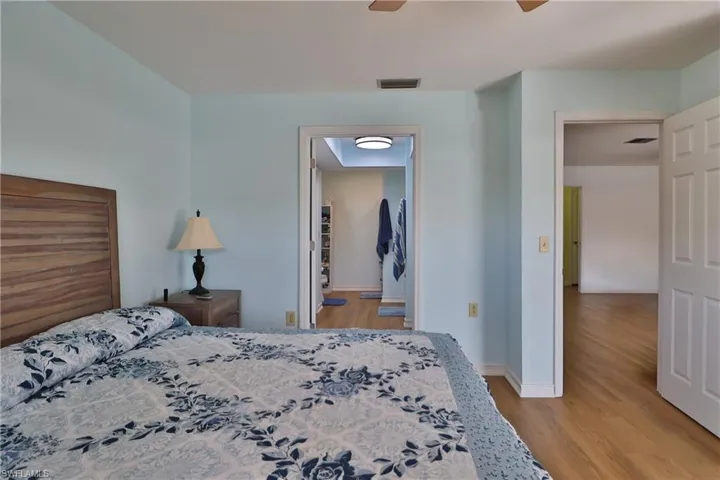 Bedroom featuring ceiling fan and light hardwood / wood-style floors