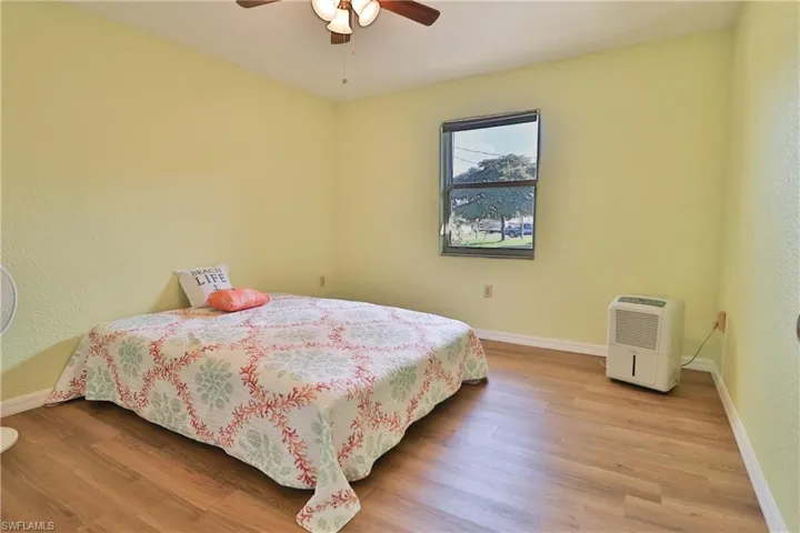 Bedroom featuring light hardwood / wood-style floors and ceiling fan