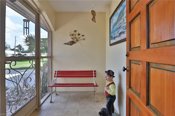 Entryway featuring light tile patterned floors