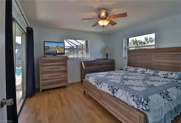 Bedroom with light hardwood / wood-style flooring and ceiling fan