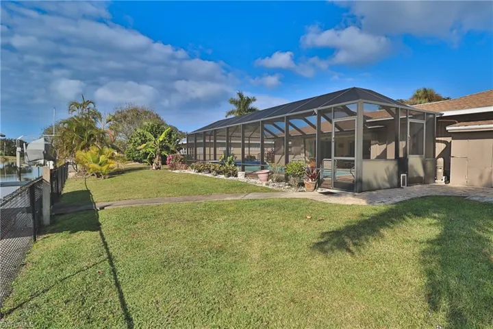 View of yard with a lanai and a patio area