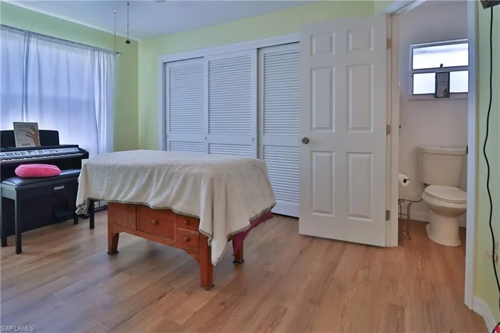 Bedroom featuring a closet and light hardwood / wood-style flooring