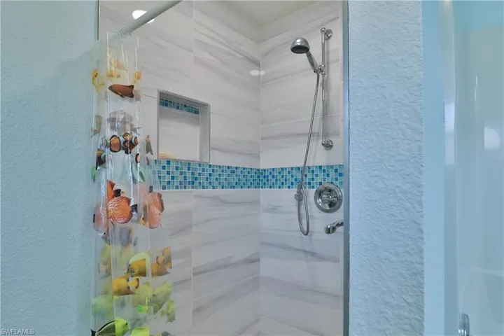 Bathroom with tiled shower