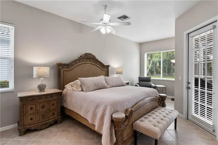 Tiled bedroom with ceiling fan