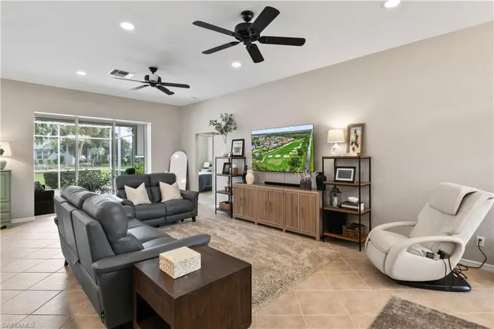 Tiled living room with ceiling fan