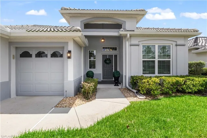 Entrance to property featuring a garage