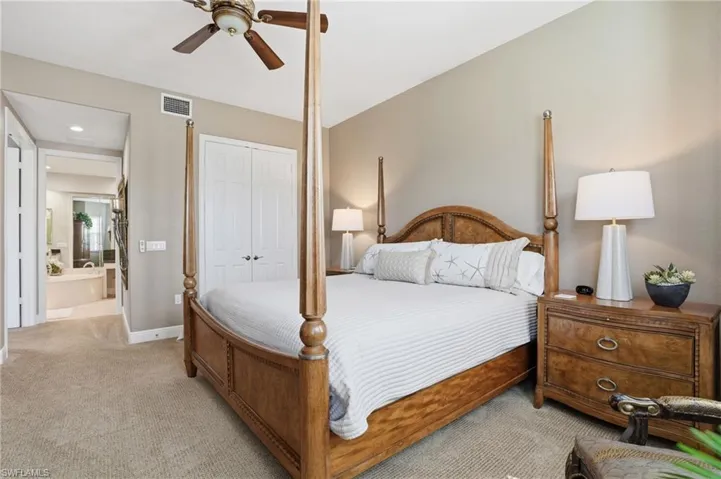 Bedroom featuring carpet, ceiling fan, and a closet