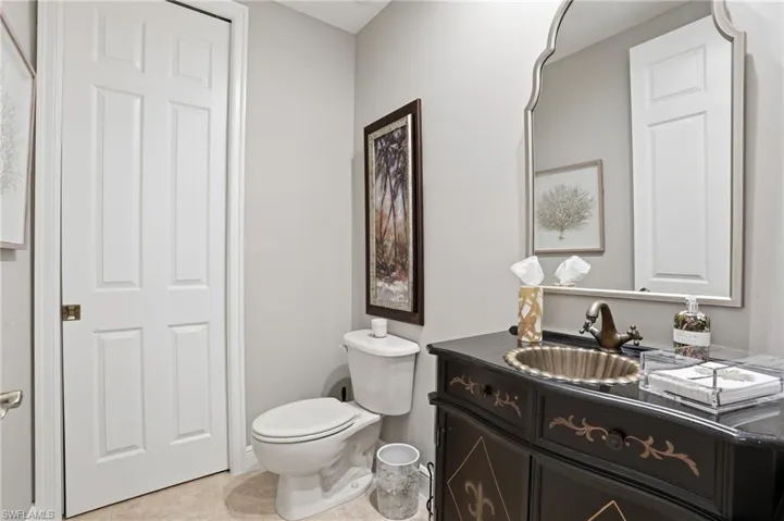 Bathroom with vanity and light tile patterned flooring