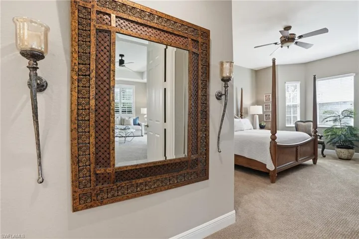 Bedroom featuring light carpet and ceiling fan