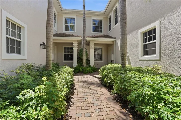 View of exterior entry featuring stucco siding