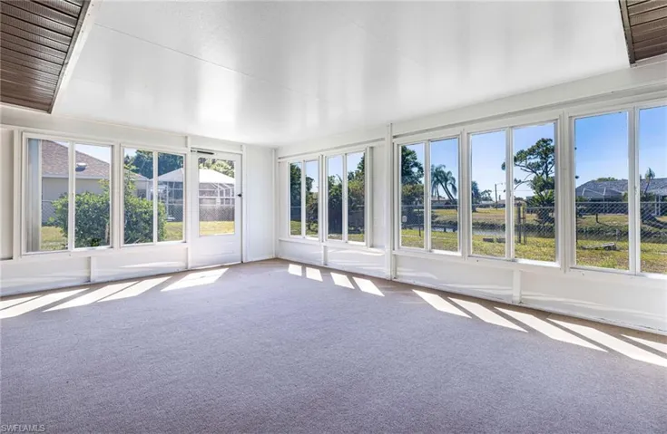 Unfurnished sunroom with plenty of natural light