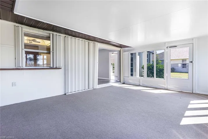Unfurnished living room with plenty of natural light and carpet floors