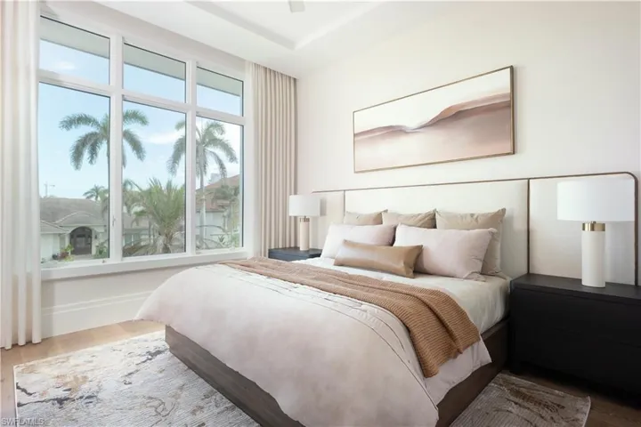 Expansive picture window with white framing and tropical landscaping beyond