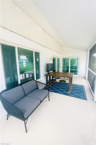 Sunroom / solarium with vaulted ceiling