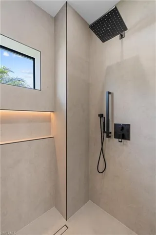Bathroom featuring walk in shower
