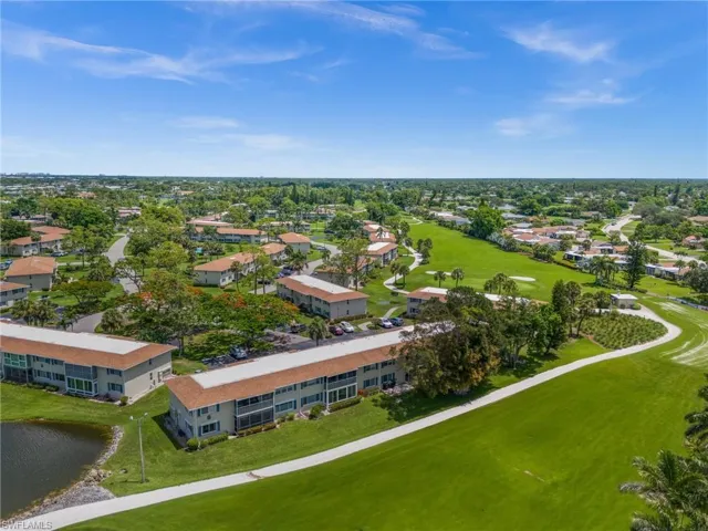 Bird's eye view of a nearby body of water and a local golf course
