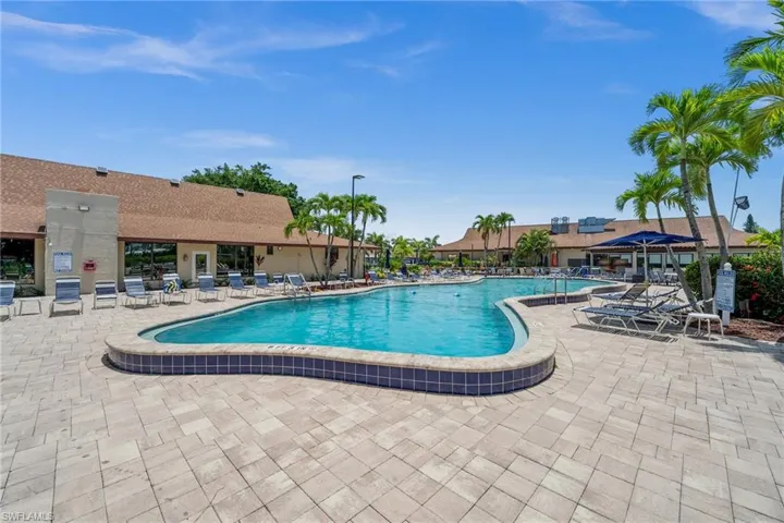 Community pool featuring a patio