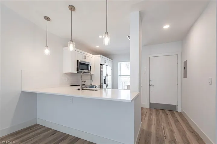 View from living/ dining to Kitchen