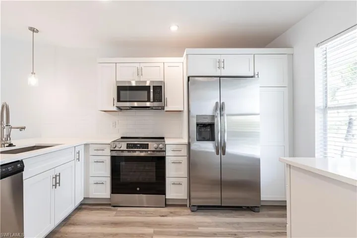 Kitchen includes a coffee bar with extra storage