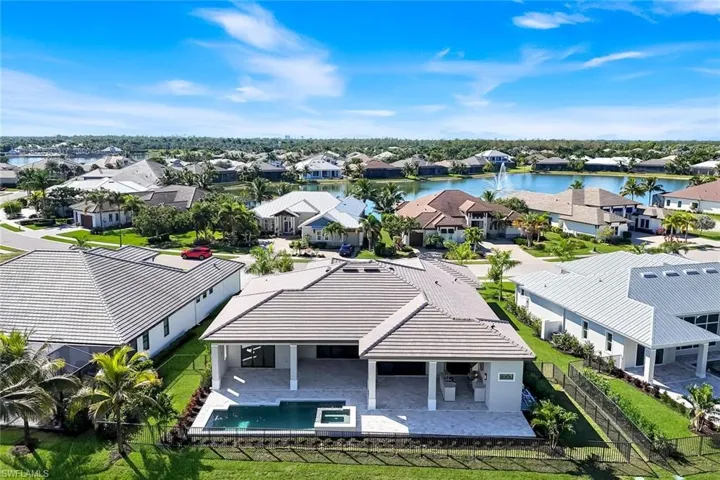 Aerial perspective of suburban area with a large body of water