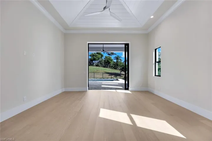 Spare room with light wood-style floors, ceiling fan, and wood ceiling
