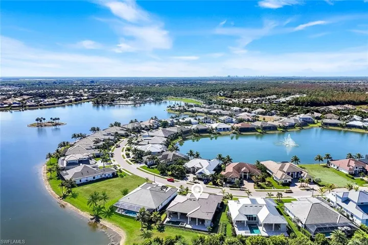 Aerial perspective of suburban area featuring a large body of water