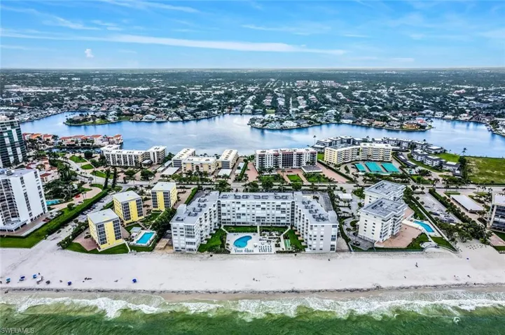 View of urban area featuring expansive beach