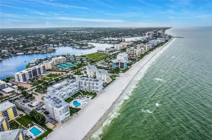 Drone / aerial view of waterfront with a beach