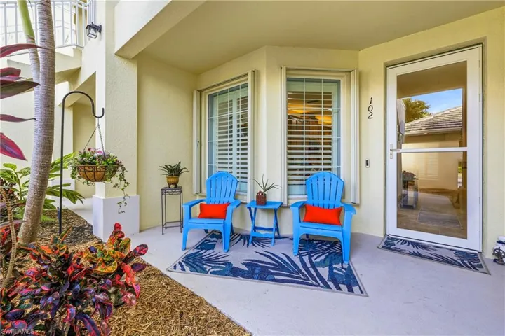 View of entryway patio / terrace and plush landscaping