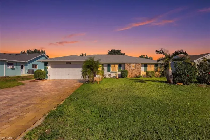 Beautifully maintained single-family home in the desirable Iona area, featuring a fresh 2024 roof, lush landscaping, and a welcoming front entry. Just minutes from Sanibel, Fort Myers Beach, and Bunche Beach.