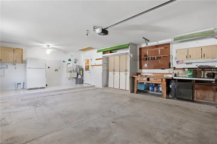 Clean 2-car garage with updated systems including newer HVAC and water heater.