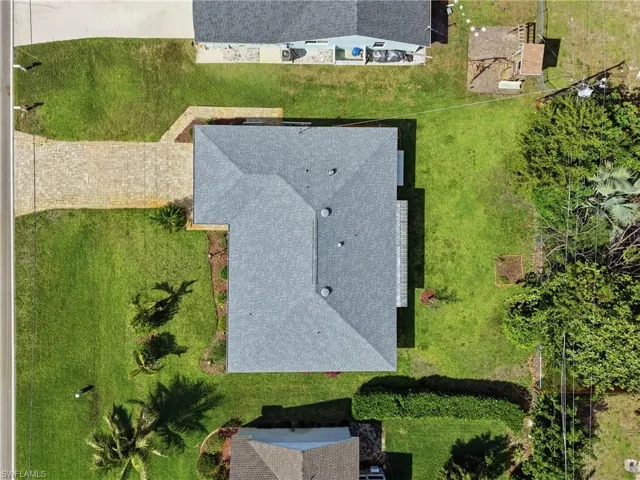 Top-down view showcasing the NEW 2024 roof, clean exterior lines, and a large backyard with plenty of room for a pool or outdoor oasis.