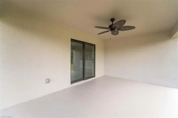 View of patio featuring ceiling fan