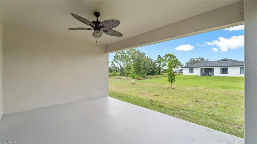 View of patio featuring ceiling fan