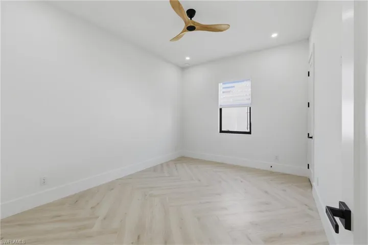 Unfurnished room featuring parquet floors, recessed lighting, and ceiling fan