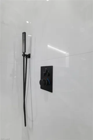 Bathroom view of a marble finish shower