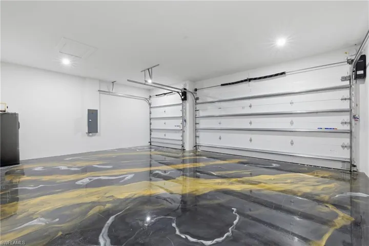 Garage featuring electric panel