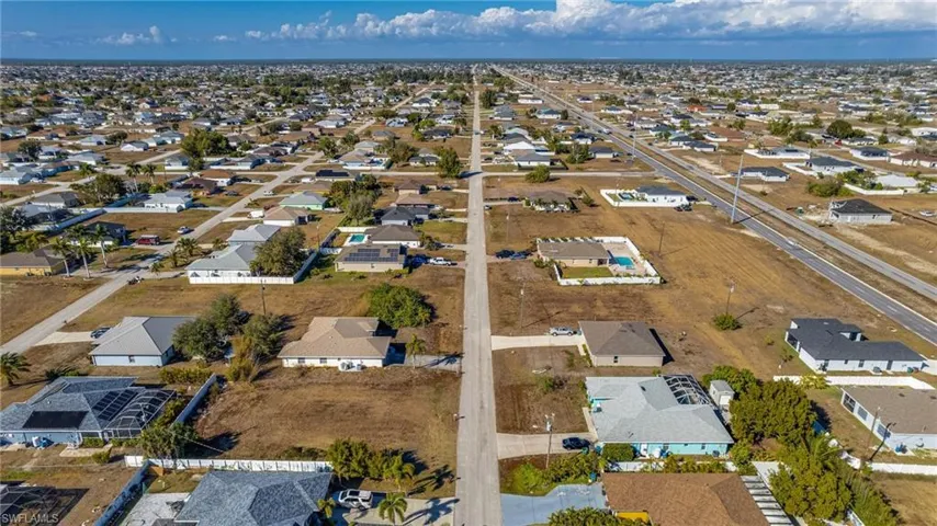 Aerial overview of property's location with nearby suburban area