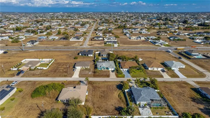 Aerial overview of property's location featuring nearby suburban area