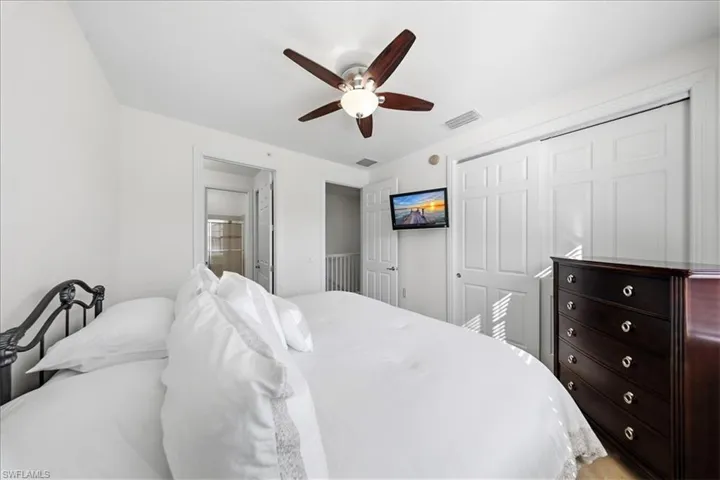 Bedroom featuring a closet and ceiling fan