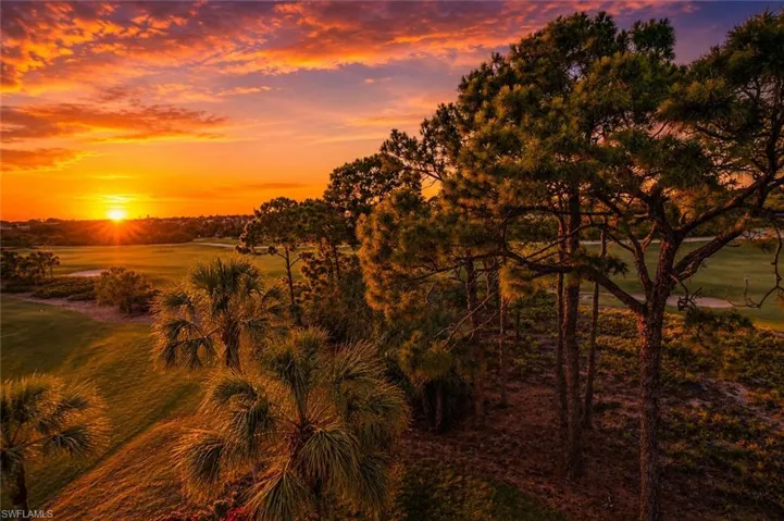Expansive golf course landscape featuring lush green fairways and sand traps