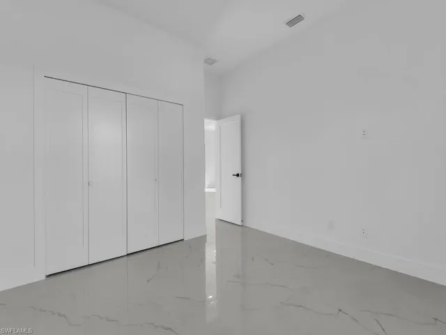 Unfurnished bedroom featuring baseboards and a closet