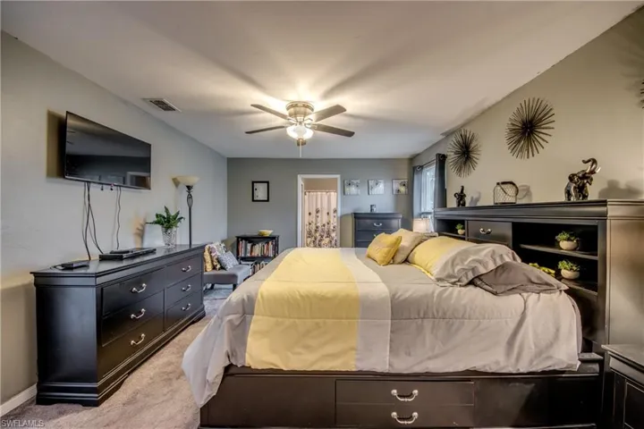 Bedroom featuring carpet and ceiling fan