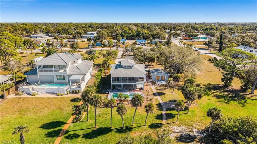Aerial perspective of suburban area with a pool area