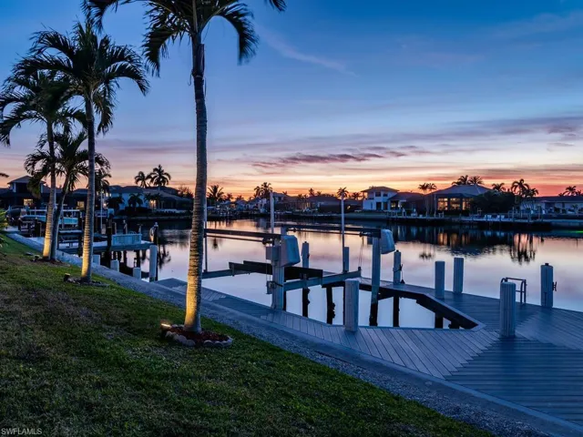 View of dock featuring a water view and a yard