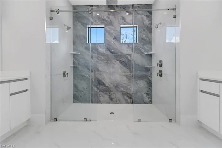 Bathroom with walk in shower and vanity