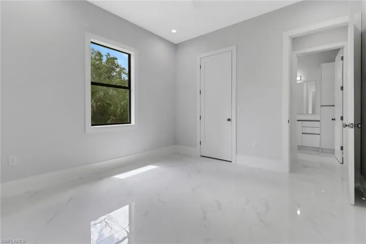 Unfurnished bedroom featuring ceiling fan