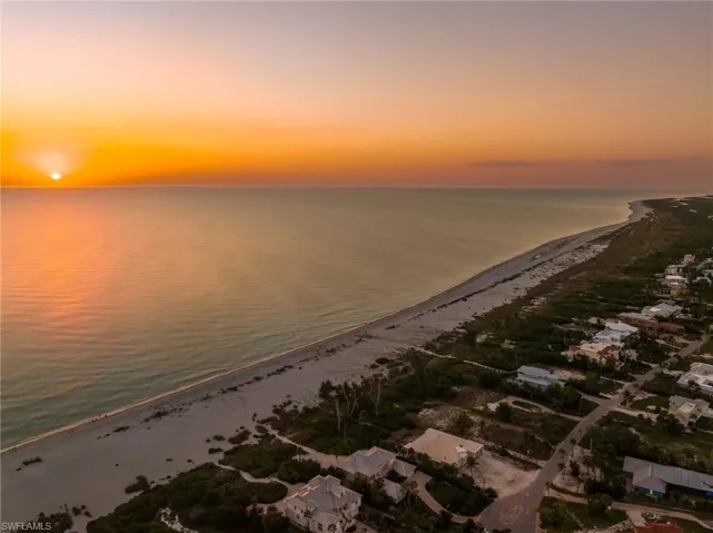 Water view featuring local beach and nearby suburban area